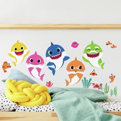 the wall decals have different types of sharks on them