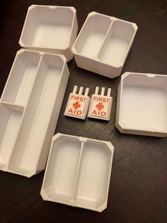 several first aid kits laid out on a table