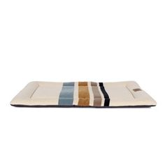 a dog bed that is made out of fabric and has multicolored stripes on it