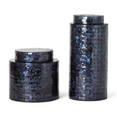 two blue tin canisters sitting next to each other