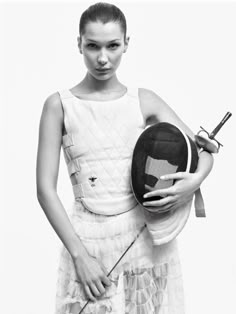 black and white photograph of a woman holding a tennis racquet