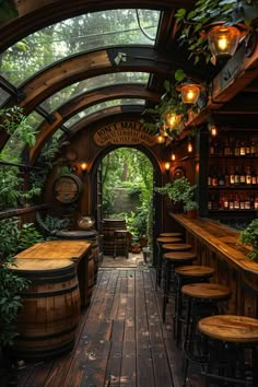 an outdoor bar with lots of wooden tables and stools in the middle of it