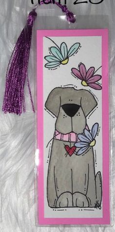 a card with a dog and flowers on it