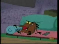 a cartoon dog laying on top of a bed