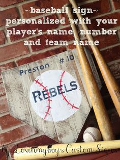 some baseball bats are next to a sign with the words, personalized with your player's name and team name