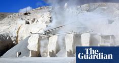 an old quarry with steam coming out of it's pipes and snow on the ground