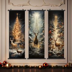 three christmas paintings hanging on the wall in a room with candles and decorations around them