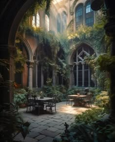 an outdoor courtyard with tables and chairs surrounded by greenery