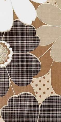 a close up view of a flower on a brown and white wallpaper with flowers in the center