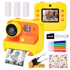 a yellow camera with pictures and stickers next to it