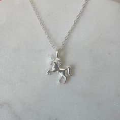 his a lovely necklace in 925 sterling silver with an unicorn as  pendant hand crafted by us. Ideal as gift or for your fashion.  The chain is about 16" with an extended 2 more inches in case you need 18" as size.  The pendant is about 16x10 mm.  925 hallmark tag. It comes in a gift package. We aim to dispatch our orders in 24 hours using free 48 hours delivery but if you need your item quicker there is an option on the checkout for next day delivery for only £ 3.50. Unicorn Jewelry, Jewellery Pendant, Unicorn Pendant, Unicorn Necklace, Chain Silver, Gift Package, Lovely Necklace, Necklace Chain, Gift Packaging