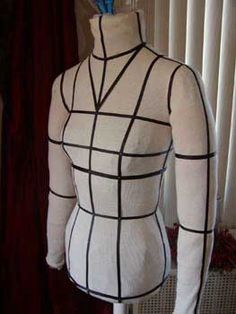 a mannequin wearing a white shirt with black lines on it's chest