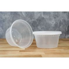 plastic container with lid on wooden table