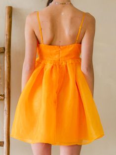 We are obsessed with the Clementine Organza Mini Dress!! Bengals season—but make it fashion! This puffy dress is so SO cute and sure to make you a stand out in any room! You will rock this! 100% Polyester Cute Flowy Party Dress, Orange A-line Dress For Brunch, Orange Summer Dresses For Holiday, Orange Flirty Dress With Spaghetti Straps, Cute A-line Mini Dress For Party, Flirty Orange Dress With Spaghetti Straps, Flirty Orange Dresses With Spaghetti Straps, Flirty Orange Spaghetti Strap Dress, Orange Ruffle Mini Dress For Vacation