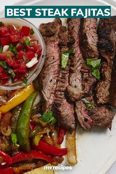 steak and peppers on a plate with the words best steak fajitas