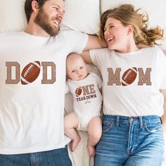 Football First Birthday Family Matching Shirts  Football 1st Birthday Tshirt, Football Theme Birthday Outfit, 1st Year Down Shirt Toddler Birthday HOW TO ORDER: 1- Please check all of the photos. 2- Select your T-shirt size from selection box. 3- Select your T-shirt color from the selection box. 4- Personalization box is only for design color information, enter your design or text color in the personalization box (see images for options). 5- Select the quantity. 6- Go to add to cart. 7- Complete Football Birthday Outfit, First Year Down Football Birthday Outfit, Personalized Cotton T-shirt For Game Day, First Birthday Graphic Tee With Name Print, Graphic Tee With Name Print For First Birthday, Personalized White T-shirt For Father's Day, White T-shirt For Father's Day Family Events, Family Matching Letter Print T-shirt For First Birthday, Personalized White Tops For Game Day