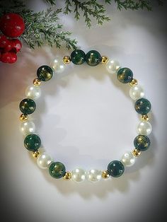 Beautiful Christmas or winter gemstone bracelet.  Beads are 8mm and are Jade, hematite and glass beads.  Bracelet stretches to fit. Green Beaded Bracelets For Christmas, Green Beaded Bracelet For Holiday, Elegant Green Beaded Bracelets For Festive Occasions, Elegant Holiday Beaded Bracelets With Round Beads, Green Round Bead Jewelry For Holidays, Christmas Green Beaded Bracelets, Holiday Green Beaded Bracelets, Green Beaded Bracelets For Holiday, Green Beaded Bracelets For Holiday Gifts