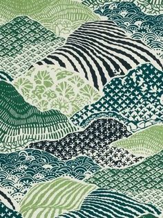 a green and white fabric with wavy lines on the side, in an abstract pattern