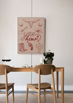 a table with two chairs and a painting on the wall