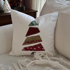 a pillow with a christmas tree on it