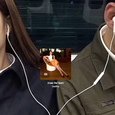 a man and woman are listening to headphones