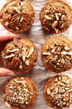 six muffins with pecans and nuts on top