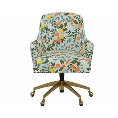 an upholstered office chair with wheels and floral print on the back, against a white background