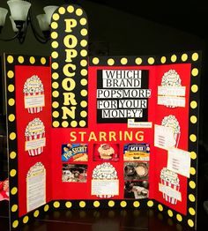 a pop corn movie display with popcorn on the front and back panels, along with other items