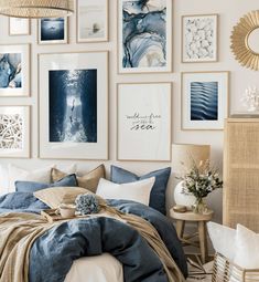 a bedroom with pictures on the wall above it