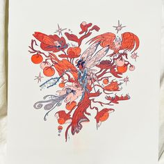 an orange and red drawing on white paper