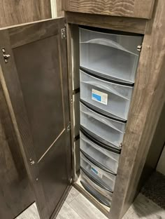 the inside of a storage cabinet with many drawers