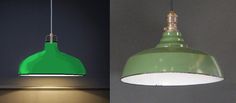 two green lamps hanging from the ceiling and one is turned on with a white light