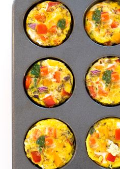 six muffin tins filled with different types of breakfast foods on top of each other