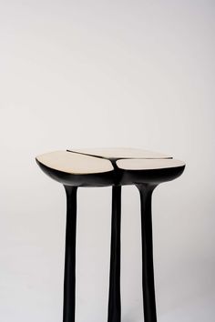 two black and white tables sitting on top of each other