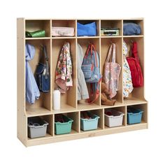 a wooden cubby filled with lots of clothes