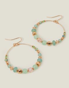 Gilded in gold and threaded with green and pink beading, these earrings boast a single hoop that hangs from a wire hook.Non-refundable. Pearl Jewelry Shop, Drop Hoop Earrings, Pearl Bridal Jewelry, Book Jewelry, Chunky Jewelry, Waterproof Jewelry, Earrings Hoop, Beaded Hoop Earrings, Beaded Hoops