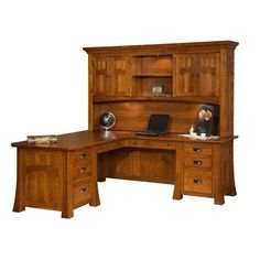 a wooden desk with a laptop on top of it next to a book shelf and cabinet