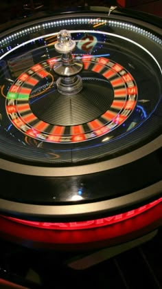 a spinning roule is lit up at night