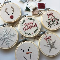 embroidered christmas ornament kits displayed on white surface