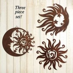 three metal sun and moon wall hangings on a white wood background with the words three piece set above them