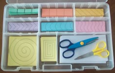 a plastic container filled with lots of crafting supplies