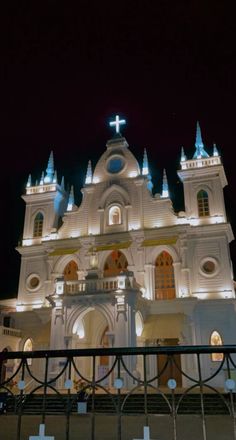 a large white church lit up at night