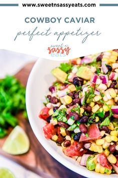 a white bowl filled with corn, black beans and cilantro on top of a wooden cutting board