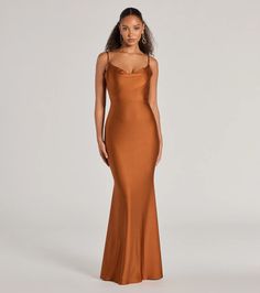 Made to celebrate enchanting evenings, the Virginia mermaid formal dress is a stunning option for bridesmaids, wedding guests, or attending soirees! The cowl neckline and spaghetti straps add a touch of elegance, while the open tie-back design allows for a sultry reveal. The mermaid silhouette and floor-length hem create a flattering and sophisticated look. Style this formal dress with dainty earrings and heels.Fit & FeaturesSleek knit fabric, moderate stretchCowl necklineSpaghetti strapsOpen tie-back designMermaid silhouetteSticky bra or pasties recommendedRuns true to size Elegant Floor-length Mermaid Bridesmaid Dress, Glamorous Mermaid Bridesmaid Dress For Prom Season, Elegant Satin Mermaid Dress For Formal Events, Elegant Satin Mermaid Dress For Formal Occasions, Elegant Satin Fishtail Evening Dress, Elegant Satin Fishtail Gown, Elegant Bridesmaid Mermaid Dress With Fitted Bodice, Glamorous Formal Mermaid Silhouette Evening Dress, Glamorous Formal Mermaid Evening Dress