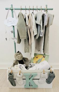 a baby's clothing rack with socks and toys