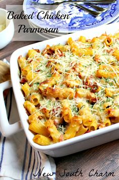 baked chicken parmesan pasta in a casserole dish on a wooden table