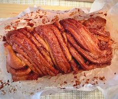 some kind of pastry sitting on top of wax paper