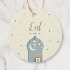 a round ceramic ornament with an eid design