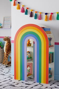 there is a rainbow book shelf in the children's room