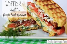 a close up of a sandwich on a plate with the words waffle blt with fresh herbs spread